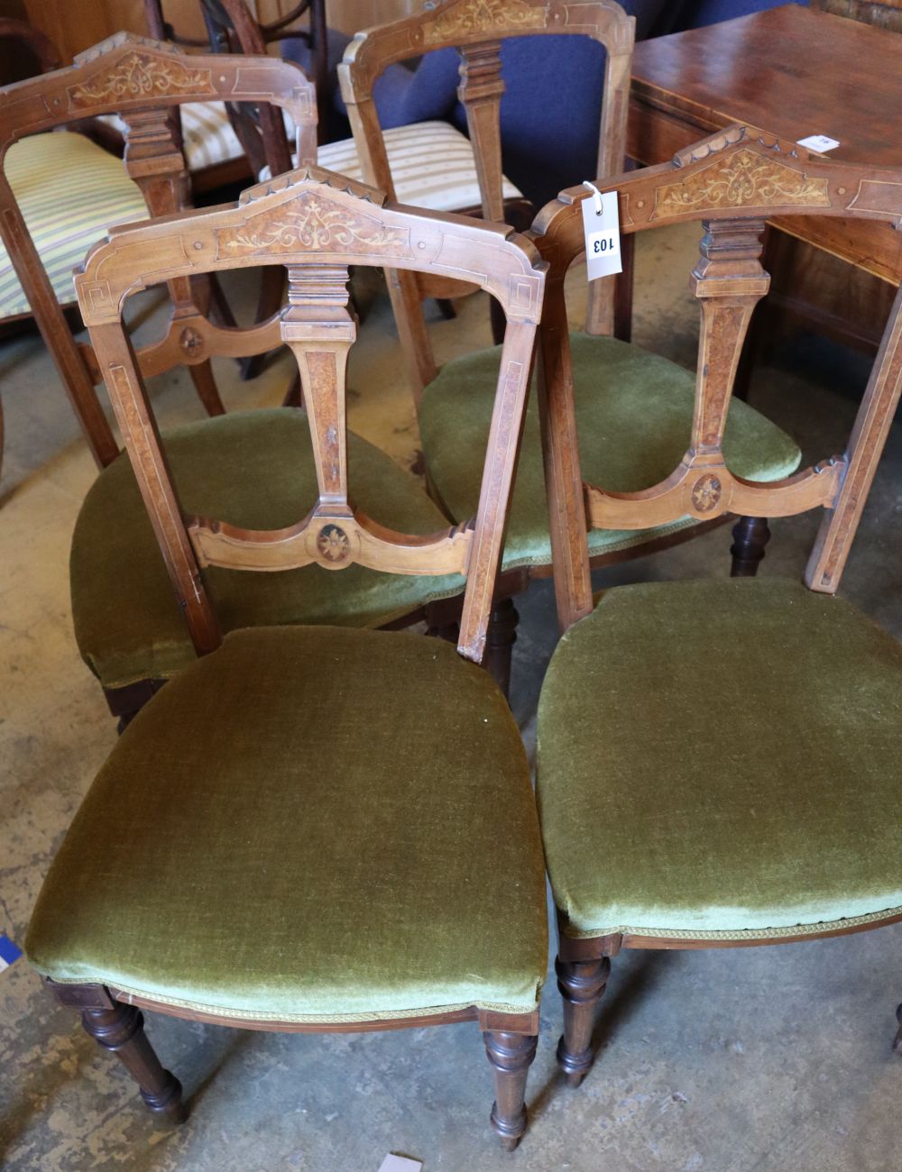 A set of four Victorian inlaid walnut dining chairs